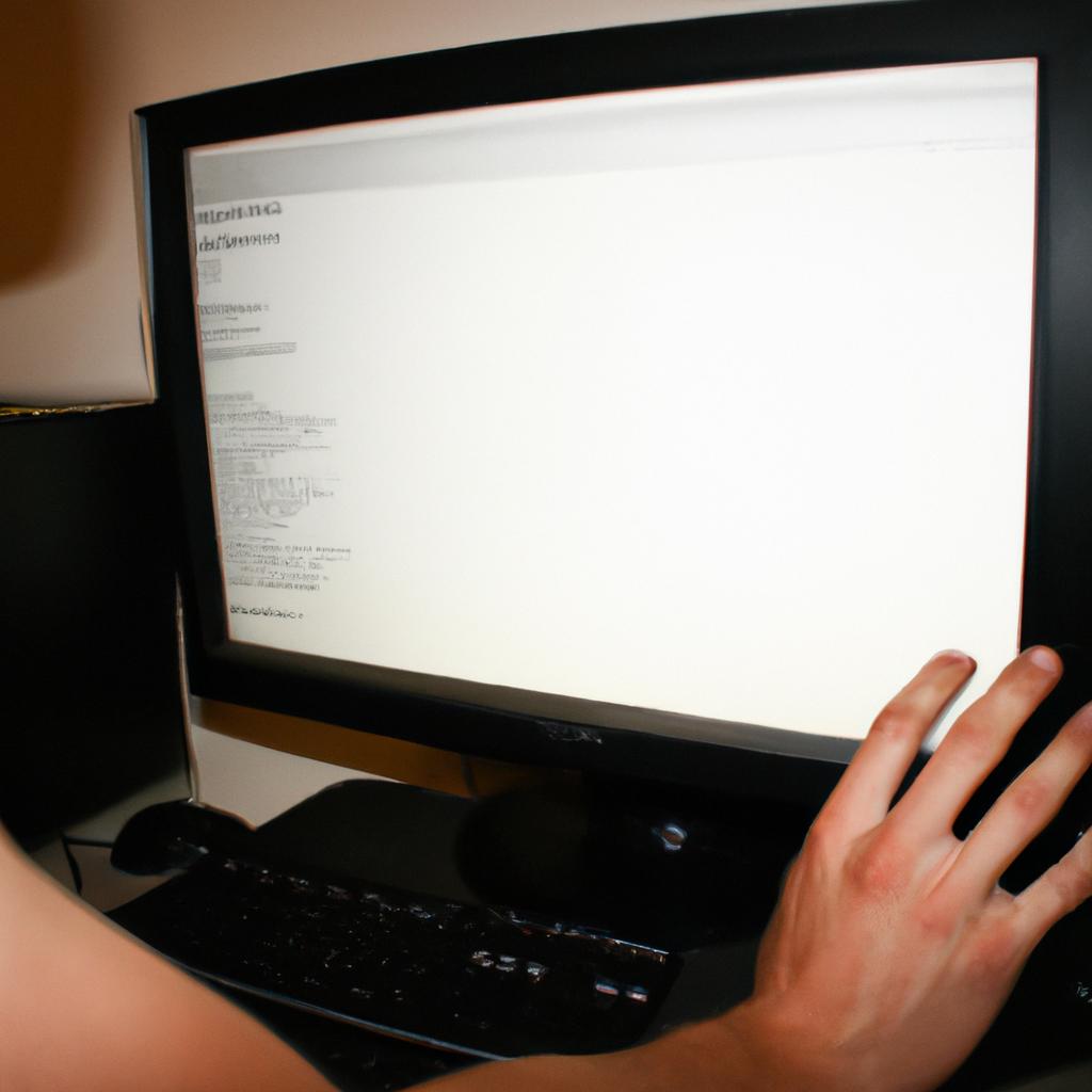 Person working on computer screen
